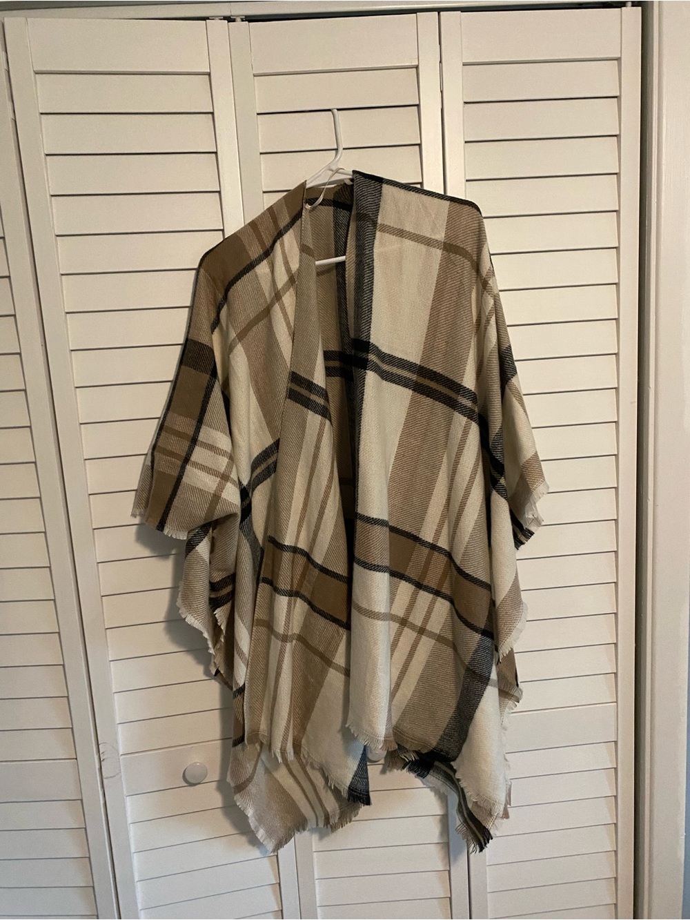 Cream, brown, and black poncho